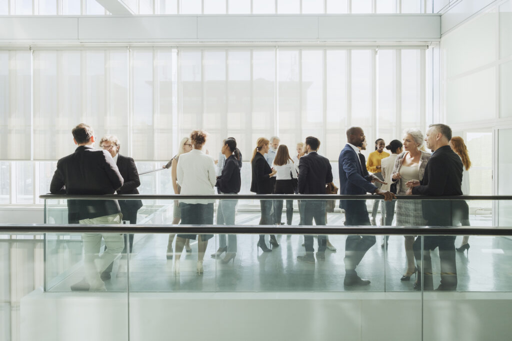 Group of business people in convention center, coffee break.