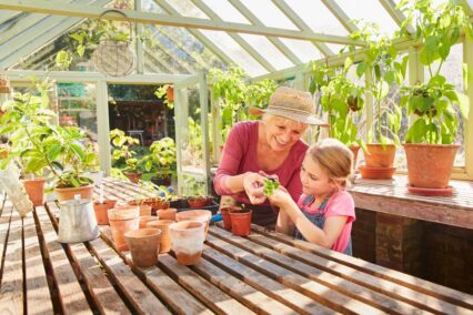 \woman with grandchild in greenhouse.