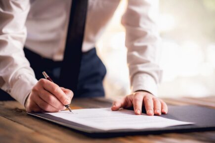 Man signing contract