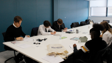 photo of trainee and students working