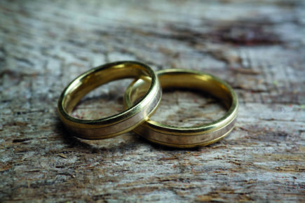 Wedding rings on wood