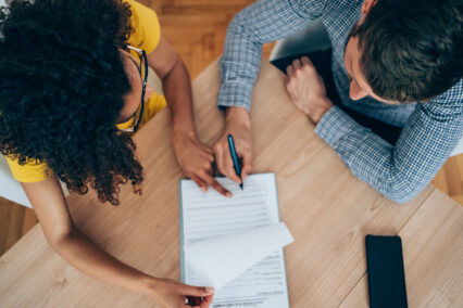 Business people signing a contract.