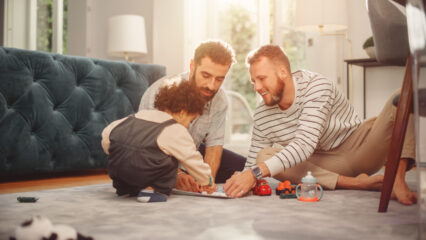 Parents playing with their child