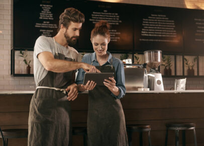 Two people working in a coffee shop