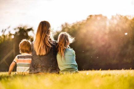 Mother and her children in a field