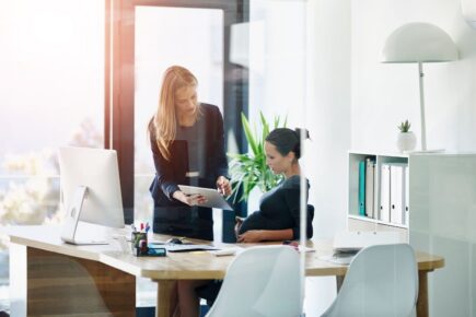 Pregnant woman working in an office