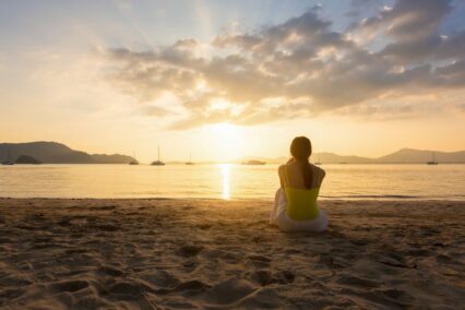 Woman sitting on a beach