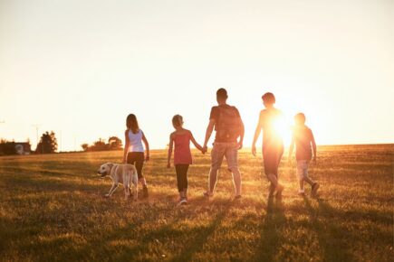 Family walking during sunset